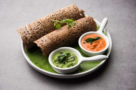 Finger Millet orÂ Ragi DosaÂ is a healthy Indian breakfast served with chutney, in roll, flat or cone shapeの写真素材