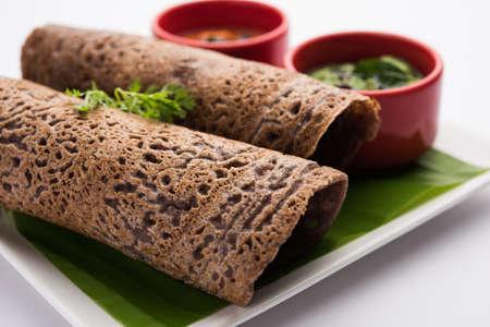 Finger Millet orÂ Ragi DosaÂ is a healthy Indian breakfast served with chutney, in roll, flat or cone shapeの写真素材