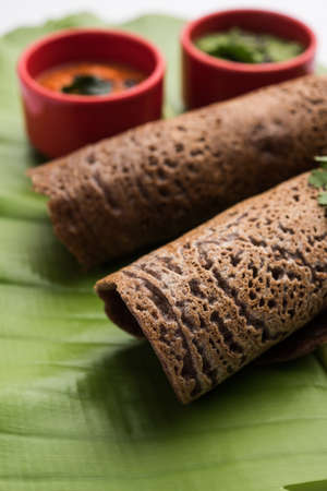 Finger Millet orÂ Ragi DosaÂ is a healthy Indian breakfast served with chutney, in roll, flat or cone shapeの写真素材