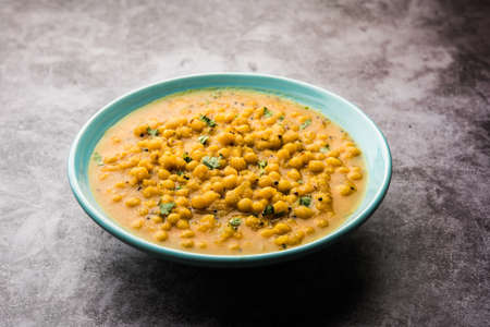 Ragda is the Indian curry made with dried white peas served in a bowl. It's flavorful, slightly tangy and spicy curry usually served withÂ a potato cutlet called patticeの写真素材
