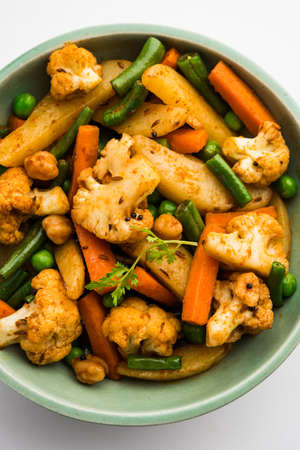 Mix Vegetable dry recipe in a bowl, Indian restaurant style veg recipe served with Chapatiの写真素材