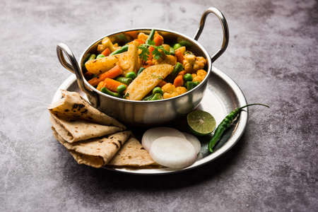 Mix Vegetable dry recipe in a bowl, Indian restaurant style veg recipe served with Chapatiの写真素材