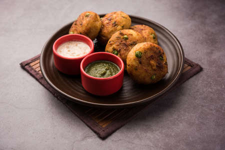 Aloo tikkiÂ orÂ Potato Cutlet or Patties is a popular Indian street food made with boiled potatoes, spices and herbsの写真素材