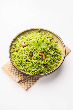 Mint Rice - Basmati rice cooked with fresh pudina leaves and garnished with Peanuts and Cashew nuts...