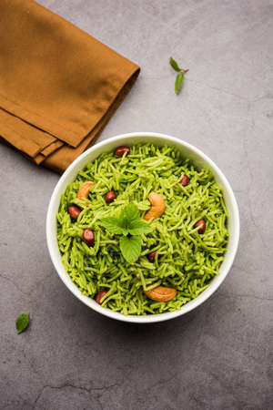 Mint Rice - Basmati rice cooked with fresh pudina leaves and garnished with Peanuts and Cashew nuts or kajuの写真素材