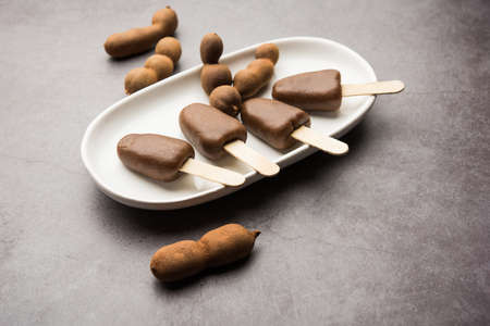 Imli stick Candy or Tamarind Lollipop is kids favourite sweet food in India