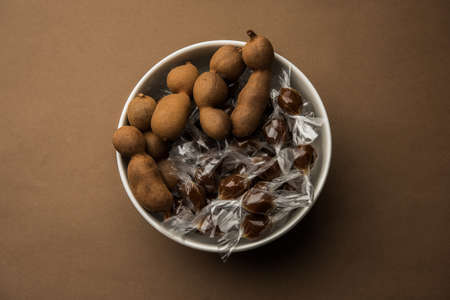 Tamarind Candy or Imli pops is made of Tamarindus indica pulp and sugar or jaggery and wrapped in...