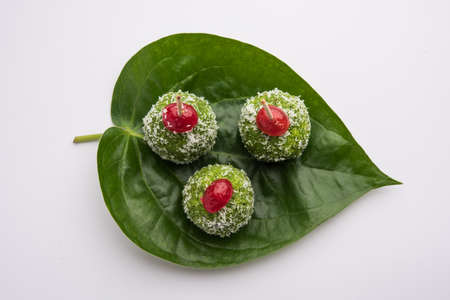 Paan Coconut LadduÂ or LadooÂ - Betel Leaves mixed with Nariyal and sugar to make sweet Balls...