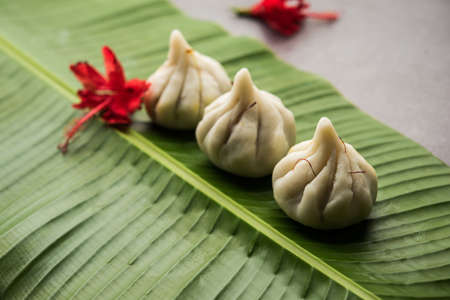 Ukdiche Modak are steamed dumplings with an outer rice flour dough and a coconut-jaggery stuffing,...