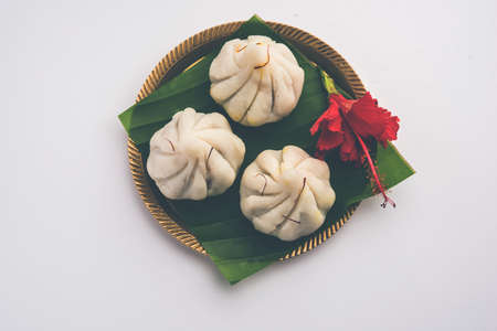 Ukdiche Modak are steamed dumplings with an outer rice flour dough and a coconut-jaggery stuffing,...
