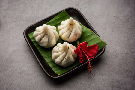 Ukdiche Modak are steamed dumplings with an outer rice flour dough and a coconut-jaggery stuffing,...