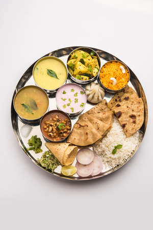 Maharashtrian food Thali or platter - Mumbai style Meal from Indian State Maharashtra includes,...