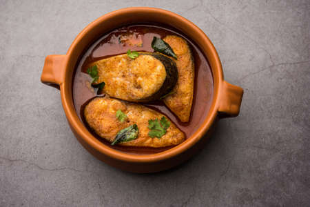 Spicy Fish Curry - kerala, konkan, bengal, goa style in Red and brown colour, served with rice