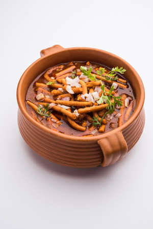 Sev BhajiÂ orÂ Shev Sabji or Kathiyavadi Dhaba StyleÂ GathiyaÂ nu shaak -Â spicy, sweet and tangy tomatoÂ curryÂ topped with crispÂ Ganthia or gathiaの写真素材
