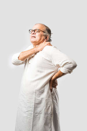 Indian asian old man having pain or ache in different body parts, sad expressionsの写真素材