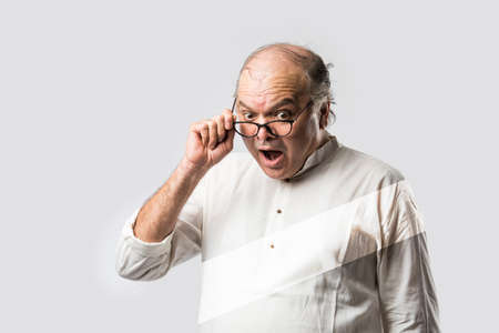 Surprised indian asian old man - senior man with shock expressionsの写真素材