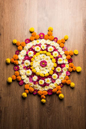 Flower Rangoli for Diwali or Pongal Festival made using Marigold or Zendu flowers and Rose petals...