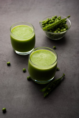 Green Peas Fresh Juice or smoothie or drink made using watana or vatana, Indian healthy green beverage served in a glassの写真素材