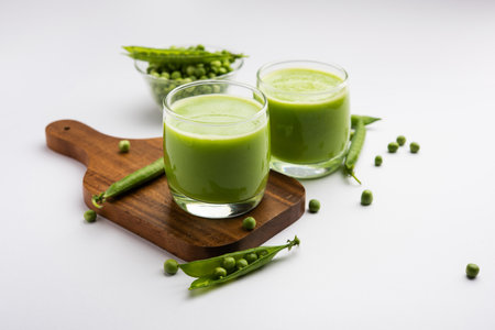 Green Peas Fresh Juice or smoothie or drink made using watana or vatana, Indian healthy green beverage served in a glassの写真素材