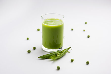 Green Peas Fresh Juice or smoothie or drink made using watana or vatana, Indian healthy green beverage served in a glassの写真素材