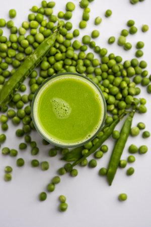 Green Peas Fresh Juice or smoothie or drink made using watana or vatana, Indian healthy green beverage served in a glassの写真素材