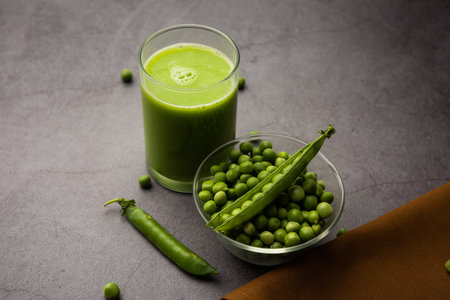 Green Peas Fresh Juice or smoothie or drink made using watana or vatana, Indian healthy green beverage served in a glassの写真素材