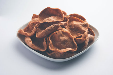 Ragi or Nachni papad or Fryums made using Nagali, it is a crispy and spicy poppadom made from...