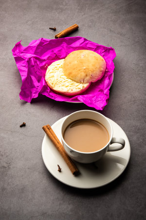 bun-maskaÂ Tea or bun Maska chaiÂ combo features a slightly sweet bun studded with raisins that is cut into half and laden with wholesome butter, Mumbai foodの写真素材