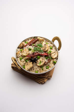 Mushroom Rice or PulavÂ or Pulao or Biryani served in a bowl or plate, selective focusの写真素材