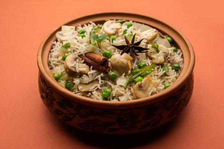 TastyÂ Mushroom or Mashroom Rice or PulavÂ or PilafÂ or Pulao or Biryani served in a bowl or plate, selective focusの写真素材