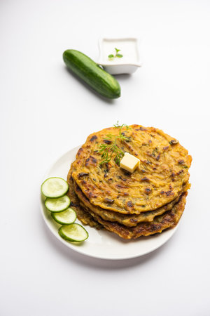 MaharashtrianÂ KakdiÂ Thalipeeth or Punjabi cucumber paratha, made from fresh gratedÂ kheeraÂ for breakfast and serve it along with yogurtの写真素材