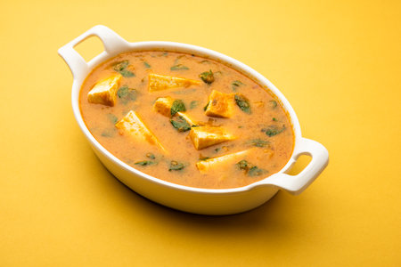 Methi Paneer Sabzi orÂ Indian Style Cottage Cheese with fenugreek leaves curry recipe. Served in a...