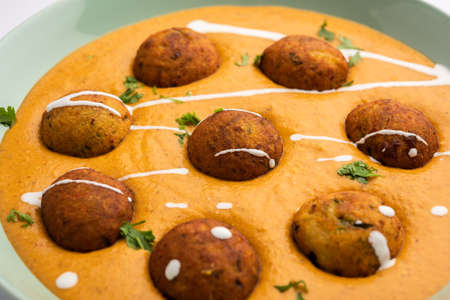 Malai Kofta CurryÂ is an indian cuisine dish with potato cottage cheese fried balls in onion tomato gravy with spicesの写真素材