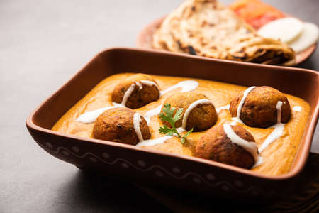 Malai Kofta CurryÂ is an indian cuisine dish with potato cottage cheese fried balls in onion tomato gravy with spicesの写真素材