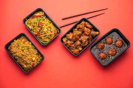 Group of home delivered Indo Chinese food in plastic packages, containersÂ or boxes...