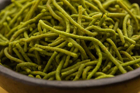 Spinach or palak sev are crunchy fried savory noodles. Homemade Thick and thin greenÂ shev or...