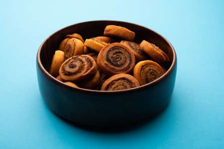 Indian Traditional tasty Snack Bhakarwadi Also Known as Bakarwadi, Bakarvadi, BhakarVadi or Bakar Wadi. Served in a plate or bowl. selective focusの写真素材
