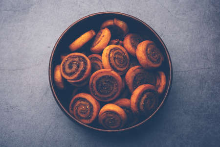 Indian Traditional tasty Snack Bhakarwadi Also Known as Bakarwadi, Bakarvadi, BhakarVadi or Bakar Wadi. Served in a plate or bowl. selective focusの写真素材