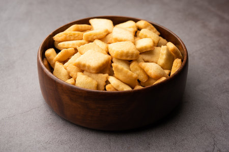 shakkarpara or shankarpali or shankarpaleÂ is diamond shape Traditional homemade indian gujarati or maharashtrian holiday sweet snack foodの写真素材