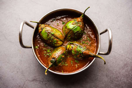 Brinjal curry also known as spicy baingan or eggplant masala, a popular main course recipe from...