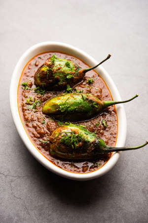Brinjal curry also known as spicy baingan or eggplant masala, a popular main course recipe from...