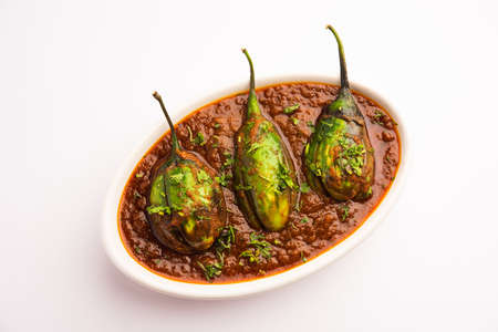 Brinjal curry also known as spicy baingan or eggplant masala, a popular main course recipe from...