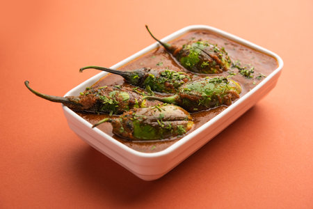 Brinjal curry also known as spicy baingan or eggplant masala, a popular main course recipe from India served in a bowl, karahi or panの写真素材