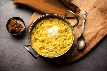 Dal Khichdi Fry With Ghee served in a bowl. Tasty Indian one pot meal. selective focus