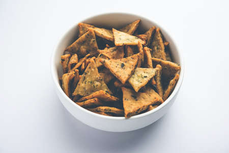 Indian Namkeen palak or Methi Mathri Triangle shape or Tikona - Salted Fenugreek or spinach leaves...