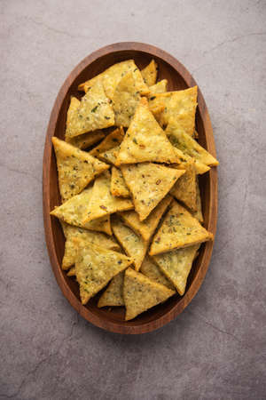 Indian Namkeen palak or Methi Mathri Triangle shape or Tikona - Salted Fenugreek or spinach leaves...