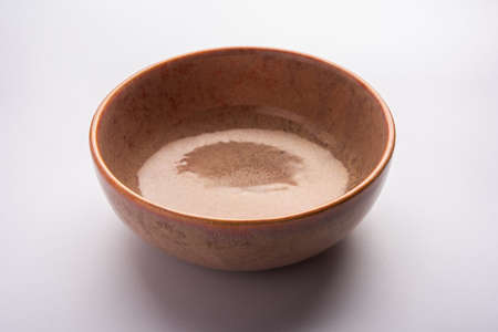 Empty brown ceramic serving bowl, isolated over white or gray background