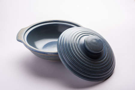 Blue empty ceramic bowl or container with lid, isolated over plain backgroundの写真素材