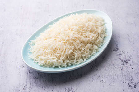 Aromatic Long Basmati cooked plain Rice is an Indian main course food, served in a bowl. selective focusの写真素材