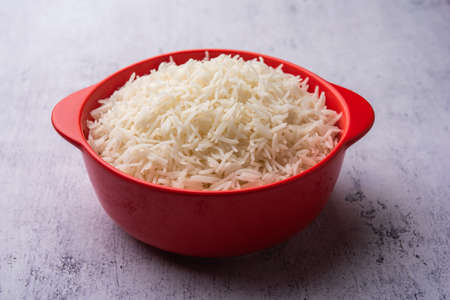 Aromatic Long Basmati cooked plain Rice is an Indian main course food, served in a bowl. selective...